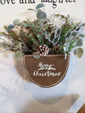 Handmade wooden merry Christmas box with winter greenery and berries