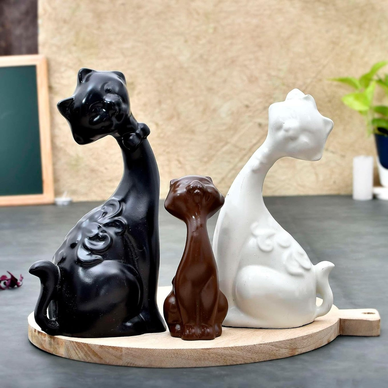 Elegant Trio of Cat Figurines in Black, Brown, and White